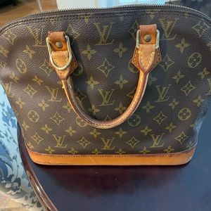 Louie Vuitton Alma Handbag
